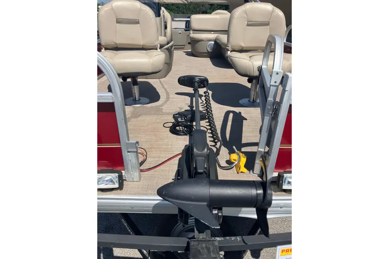 Slide: The Image of 2020 Sun Tracker Bass Buggy 18 DLX pontoon boat interior with beige seating. - 8