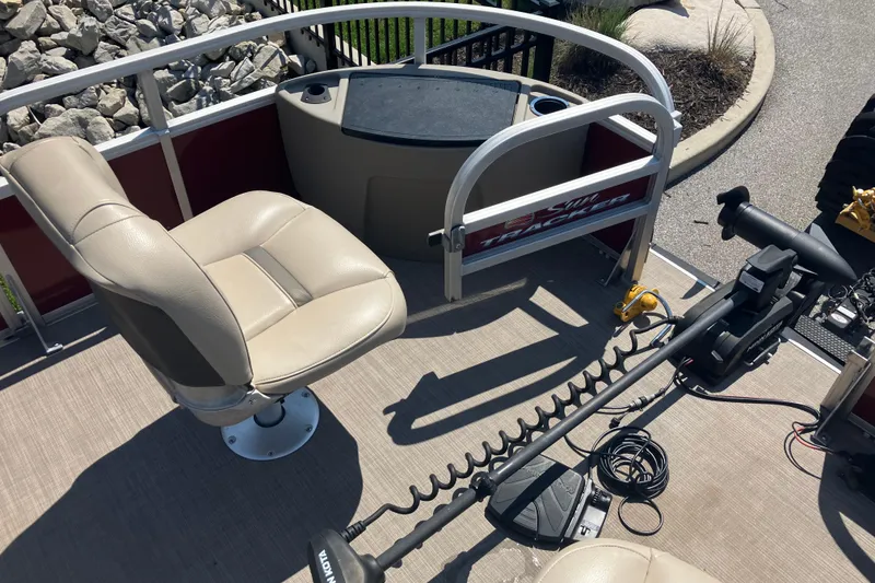 Slide: The Image of 2020 Sun Tracker Bass Buggy 18 DLX interior with seating and trolling motor. - 13