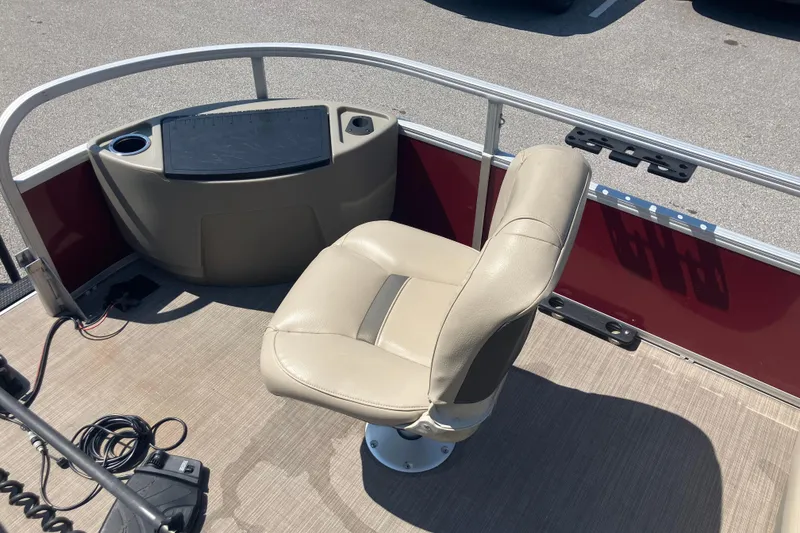 Slide: The Image of 2020 Sun Tracker Bass Buggy 18 DLX boat interior with beige captain's chair. - 12