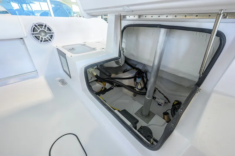 Slide: The Image of Open storage compartment in 2027 Sportsman Heritage 231 Center Console boat interior. - 39