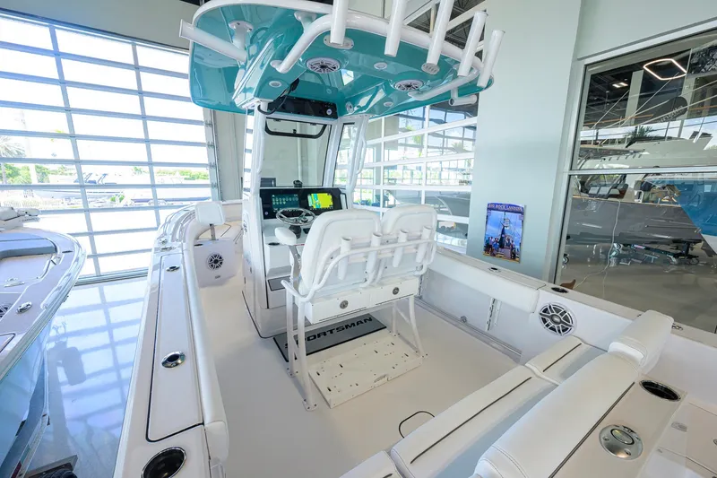 Slide: The Image of 2027 Sportsman Heritage 231 Center Console boat interior with modern helm and seating. - 36