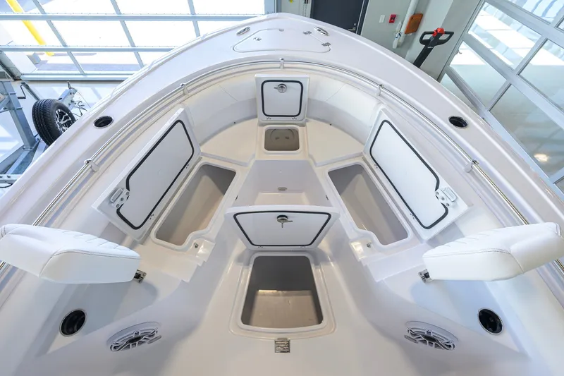 Slide: The Image of 2027 Sportsman Heritage 231 Center Console boat interior with open storage compartments. - 18