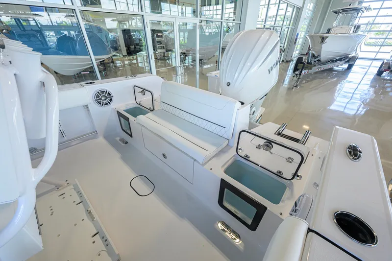 Slide: The Image of 2027 Sportsman Heritage 231 Center Console boat interior with seating and storage compartments. - 34
