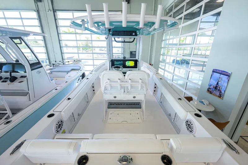 Slide: The Image of 2027 Sportsman Heritage 231 Center Console boat interior in showroom setting. - 35