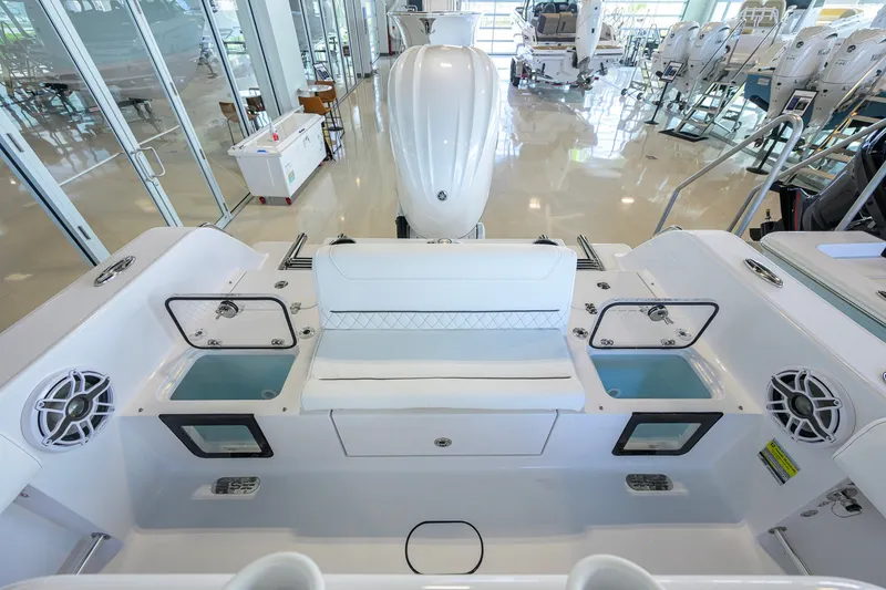Slide: The Image of 2027 Sportsman Heritage 231 Center Console boat interior with seating and storage compartments. - 32