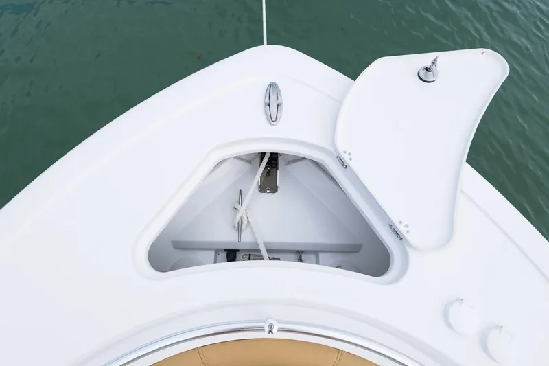 Slide: The Image of Bow storage compartment of 2026 Sportsman Heritage 231 Center Console boat. - 3