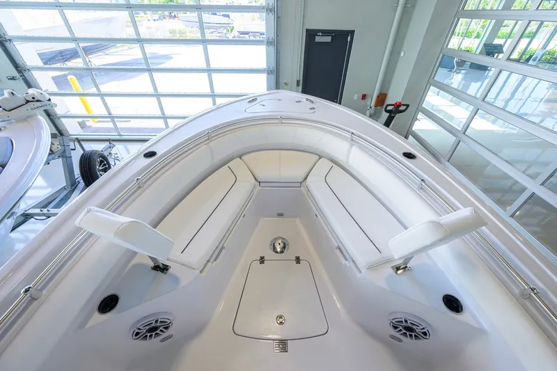 Slide: The Image of 2027 Sportsman Heritage 231 Center Console boat interior with white seating and modern design. - 14