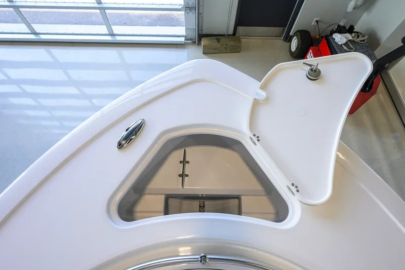 Slide: The Image of Open storage compartment on 2027 Sportsman Heritage 231 Center Console boat. - 17