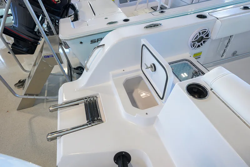 Slide: The Image of 2027 Sportsman Heritage 231 Center Console boat interior with storage compartment and ladder. - 41