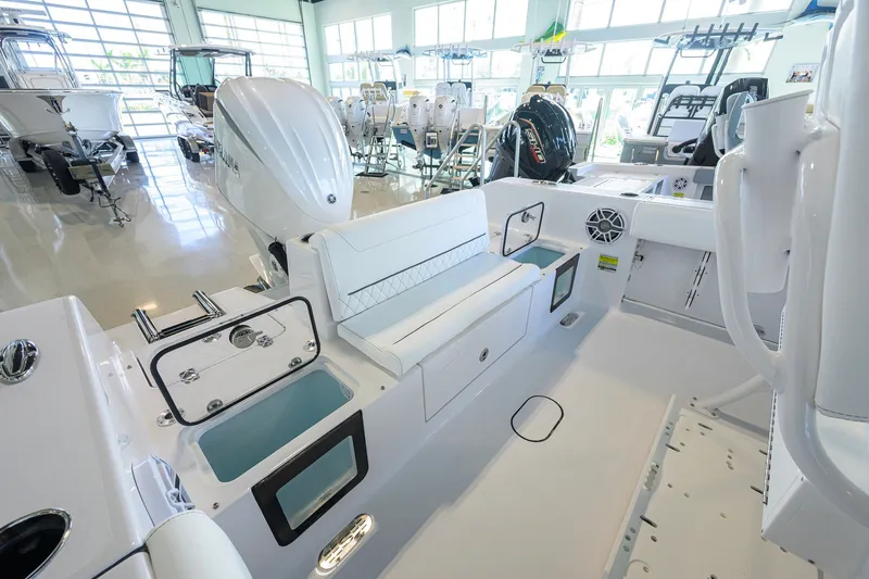 Slide: The Image of 2027 Sportsman Heritage 231 Center Console boat interior with seating and storage features. - 30