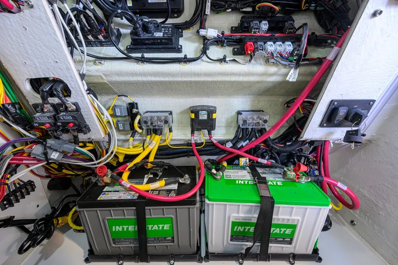 Slide: The Image of Electrical system of 2027 Sportsman Heritage 231 Center Console with batteries and wiring. - 49