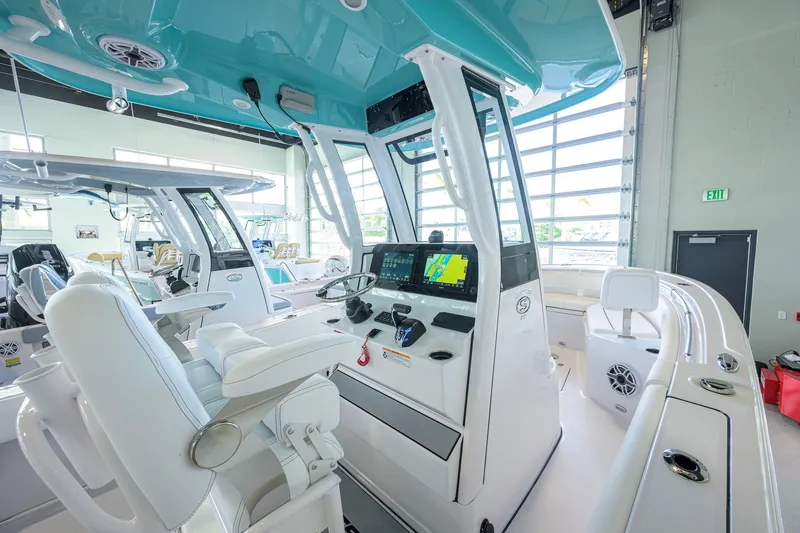 Slide: The Image of 2027 Sportsman Heritage 231 Center Console boat interior with modern navigation system. - 28