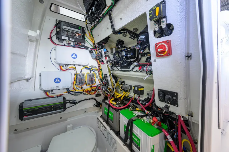 Slide: The Image of Electrical system inside 2027 Sportsman Heritage 231 Center Console boat, showcasing wiring and components. - 48