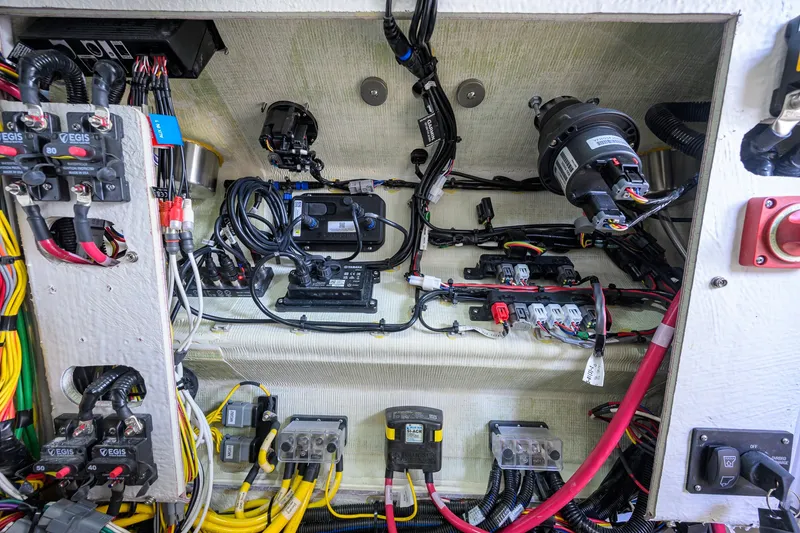 Slide: The Image of Electrical wiring and components inside a 2027 Sportsman Heritage 231 Center Console boat. - 50
