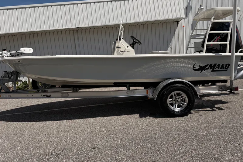 The Image of 2026 Mako 18 Pro Skiff boat on trailer, parked outdoors. - 0