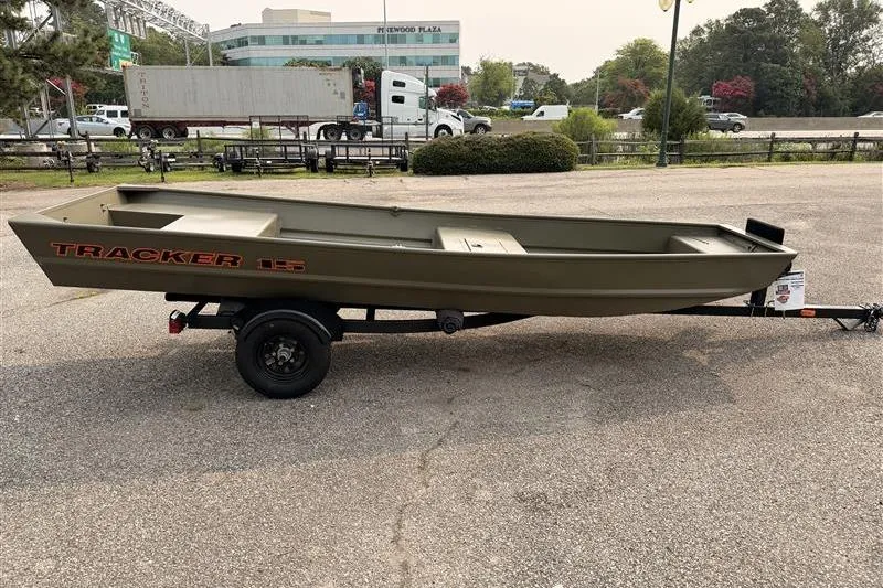 Slide: The Image of 2026 Tracker Grizzly 15 Jon boat on trailer in parking lot. - 4