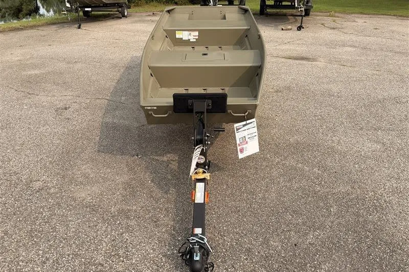 Slide: The Image of 2026 Tracker Grizzly 15 Jon boat on trailer in parking lot. - 2