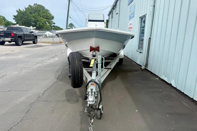 Slide: The Image of Frontier 2104 boat on trailer beside building, 2023 model. - 4