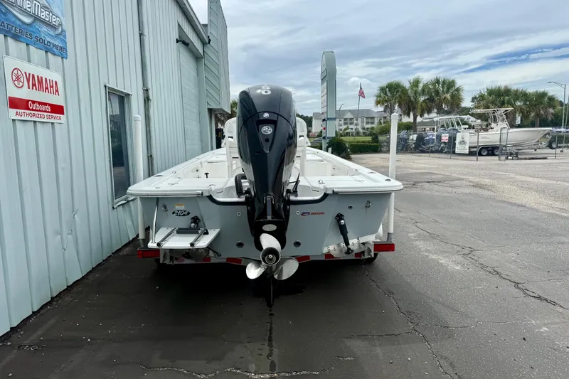 Slide: The Image of 2023 Frontier 2104 boat with Yamaha outboard motor at authorized service center. - 3