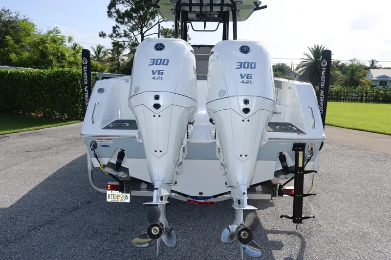 Slide: The Image of 2025 Sea Hunt Gamefish 28 Coffin Box with twin Yamaha 300 V6 engines, rear view. - 10
