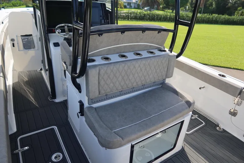 Slide: The Image of 2025 Sea Hunt Gamefish 28 Coffin Box interior with seating and rod holders. - 25