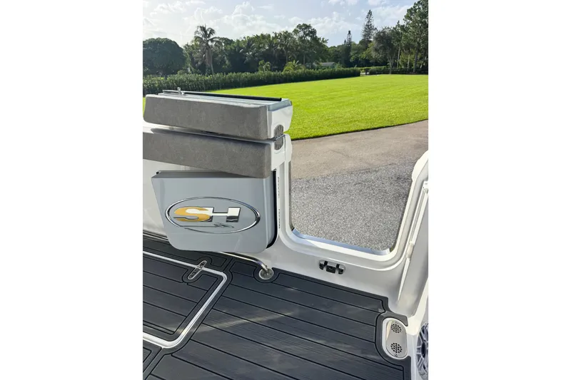 Slide: The Image of 2025 Sea Hunt Gamefish 28 Coffin Box boat, featuring sleek design and cushioned seating. - 31