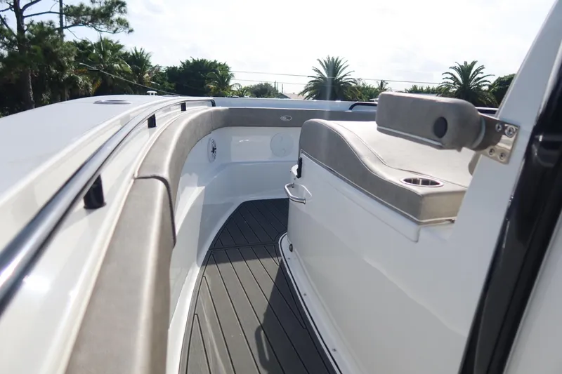 Slide: The Image of 2025 Sea Hunt Gamefish 28 Coffin Box boat interior with cushioned seating and sleek design. - 19