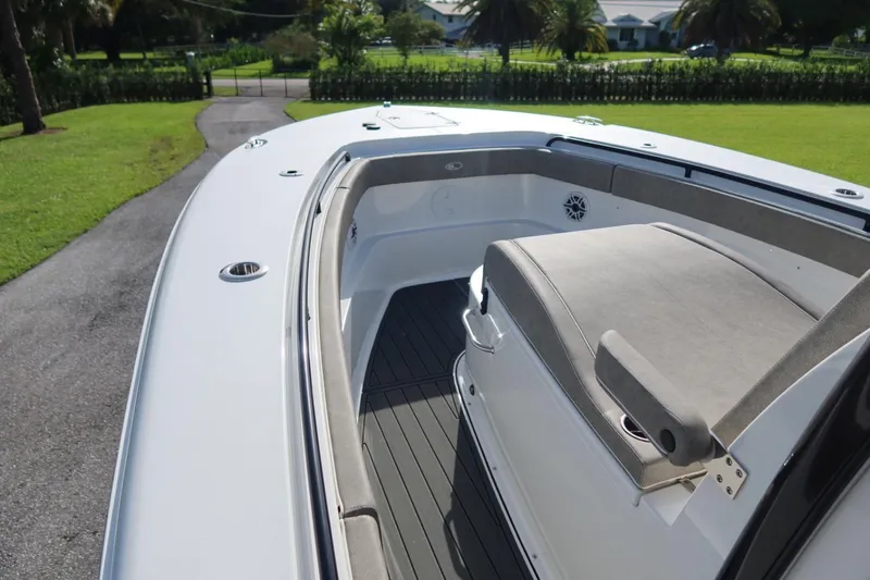 Slide: The Image of 2025 Sea Hunt Gamefish 28 Coffin Box boat interior with cushioned seating and sleek design. - 17