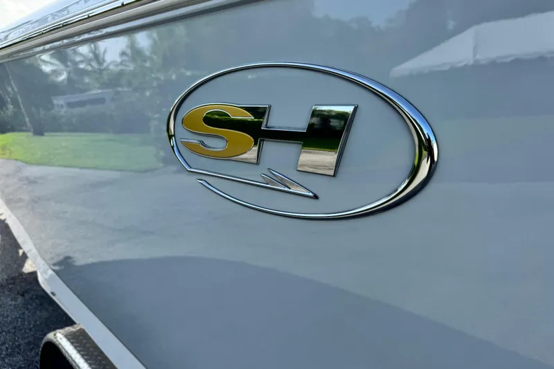 Slide: The Image of 2025 Sea Hunt Gamefish 28 Coffin Box logo on boat exterior. - 9