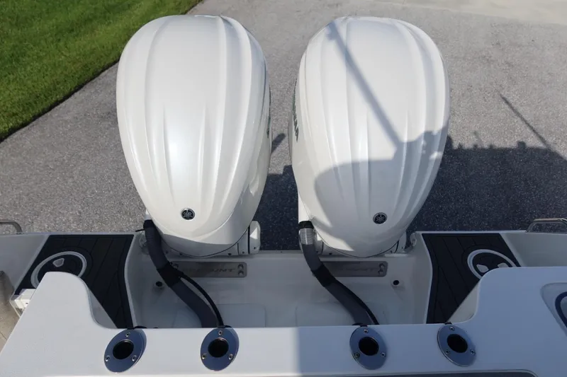 Slide: The Image of Twin outboard engines on a 2025 Sea Hunt Gamefish 28 Coffin Box boat. - 33