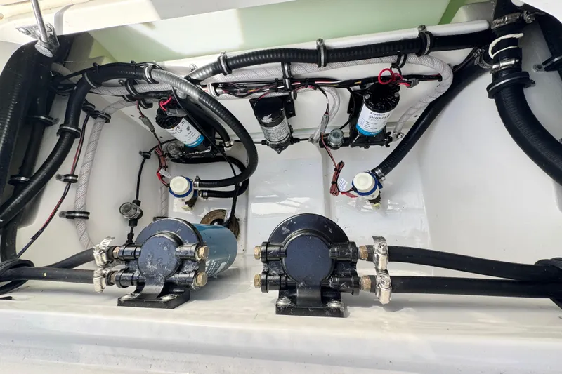 Slide: The Image of 2025 Sea Hunt Gamefish 28 Coffin Box boat interior wiring and pump system. - 32