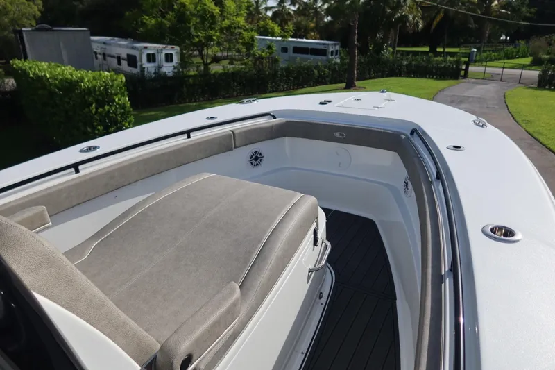 Slide: The Image of 2025 Sea Hunt Gamefish 28 Coffin Box boat with cushioned seating and sleek design. - 16