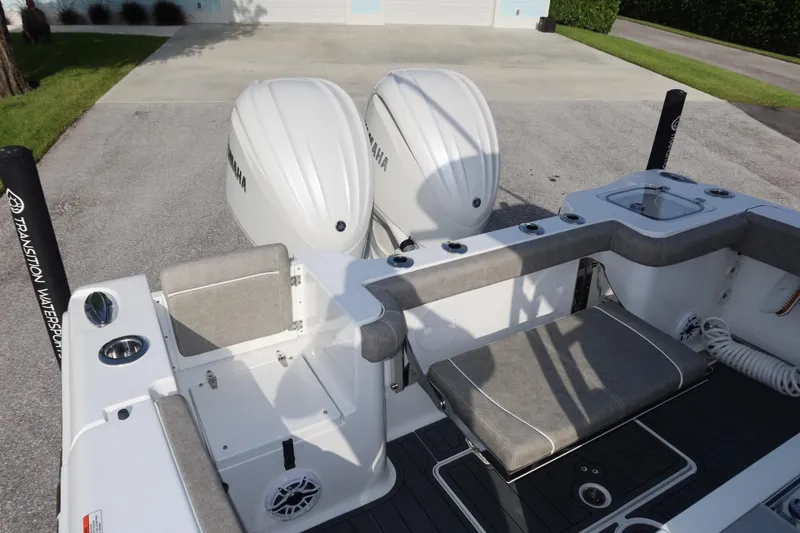 Slide: The Image of 2025 Sea Hunt Gamefish 28 Coffin Box boat with dual Yamaha engines, featuring spacious seating. - 30