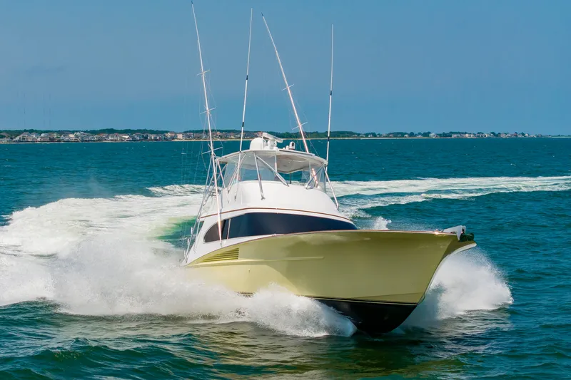 Slide: The Image of A 2022 Scarborough 63 speeds across the sea, surrounded by splashing water. - 4