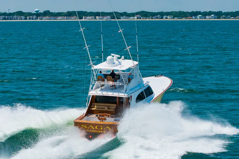Slide: The Image of A 2022 Scarborough 63 speeds across the sea, with a clear view of the stern. - 7