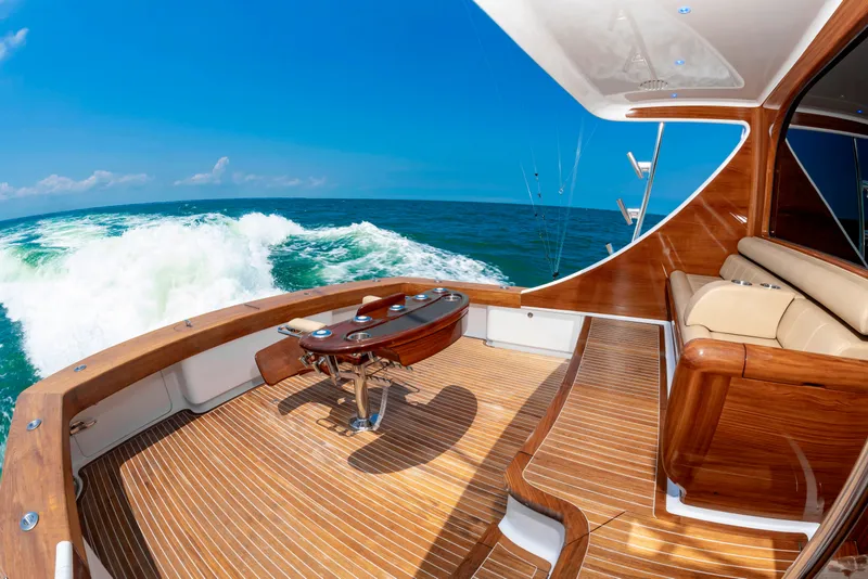 Slide: The Image of The image shows the aft deck of a 2022 Scarborough 63 yacht with elegant wood interior. - 40