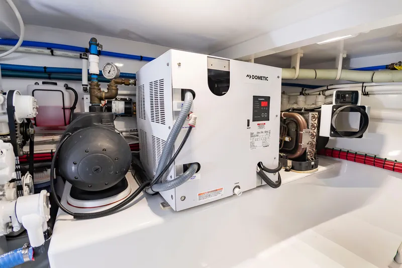 Slide: The Image of Engine room of a 2022 Scarborough 63 with Dometic equipment and piping. - 23
