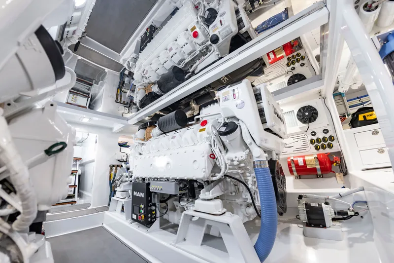 Slide: The Image of The engine room of a 2022 Scarborough 63 boat features two large engines and various technical equipment. - 11