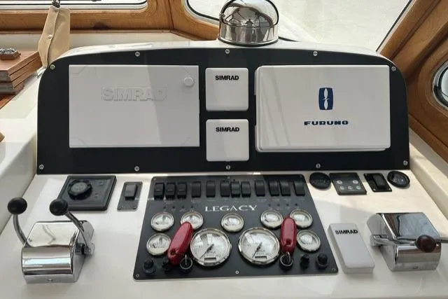 Slide: The Image of Control panel of a 2002 Legacy Express boat with Simrad and Furuno equipment. - 6