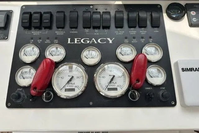 Slide: The Image of Dashboard of a 2002 Legacy Express with various gauges and switches. - 7