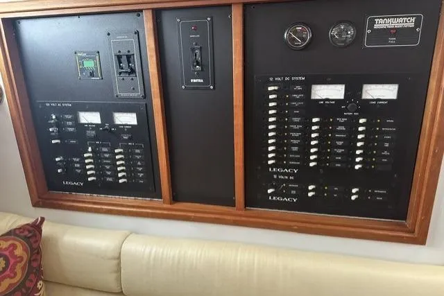 Slide: The Image of Electrical control panel on a 2002 Legacy Express boat, featuring gauges and switches. - 13