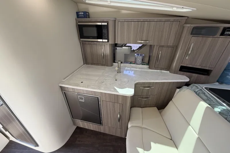 Slide: The Image of 2021 Regal 35 Sport Coupe interior kitchen with modern cabinetry and appliances. - 30
