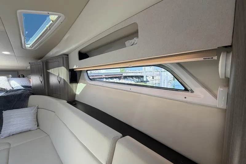 Slide: The Image of Interior of 2021 Regal 35 Sport Coupe with modern furnishings and large window. - 26