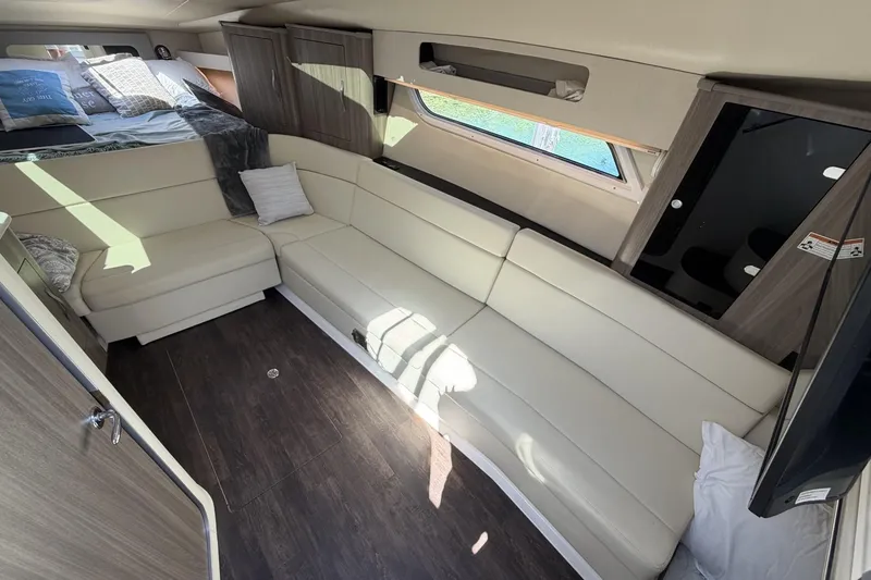 Slide: The Image of Interior of 2021 Regal 35 Sport Coupe with modern seating and cozy sleeping area. - 24