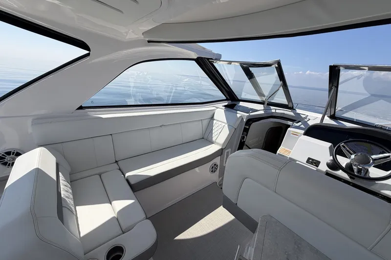 Slide: The Image of 2021 Regal 35 Sport Coupe interior with luxurious seating and modern helm. - 14