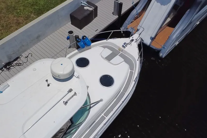 Slide: The Image of Aerial view of a 2004 Century 3200 Walk-Around boat docked at a marina. - 15