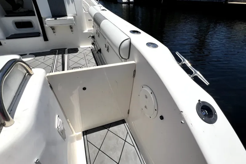 Slide: The Image of 2004 Century 3200 Walk-Around boat interior with open side door and seating area. - 73