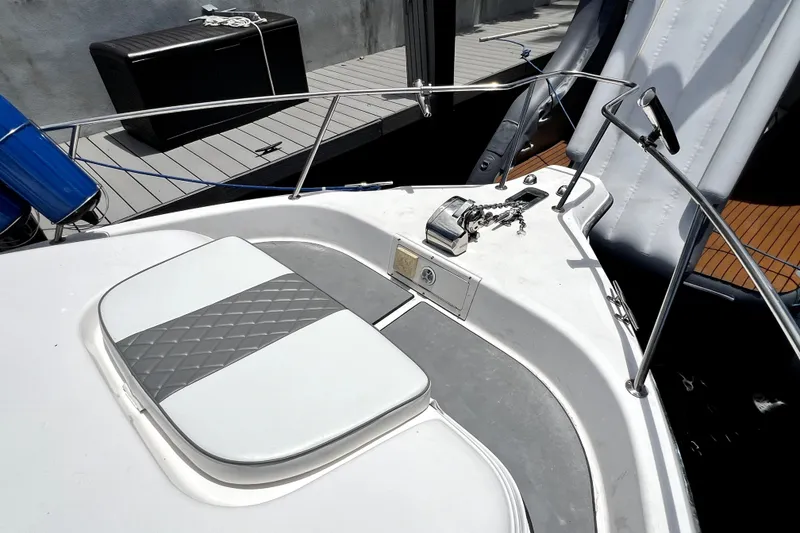 Slide: The Image of 2004 Century 3200 Walk-Around boat deck with seating and anchor chain. - 44