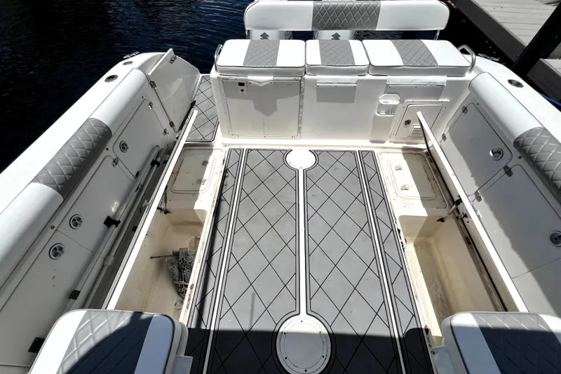 Slide: The Image of Overhead view of a 2004 Century 3200 Walk-Around boat deck with storage compartments. - 88