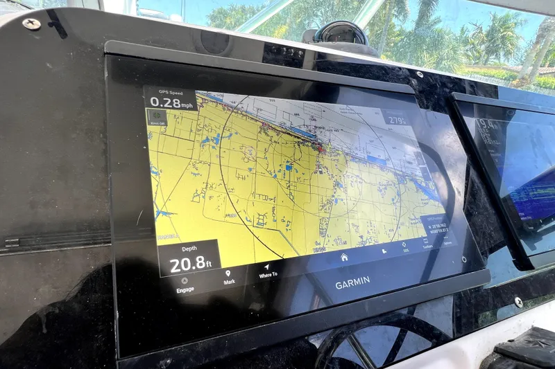 Slide: The Image of Garmin navigation display on 2004 Century 3200 Walk-Around boat, showing map and speed data. - 95